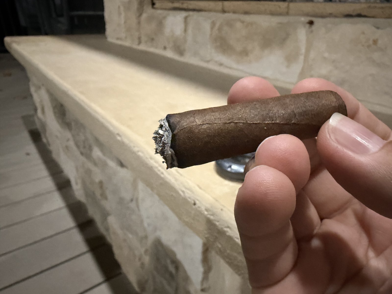 Arturo Fuente Hemingway Short Story just after ashing, band removed, showing an even burn line at the midpoint of the cigar