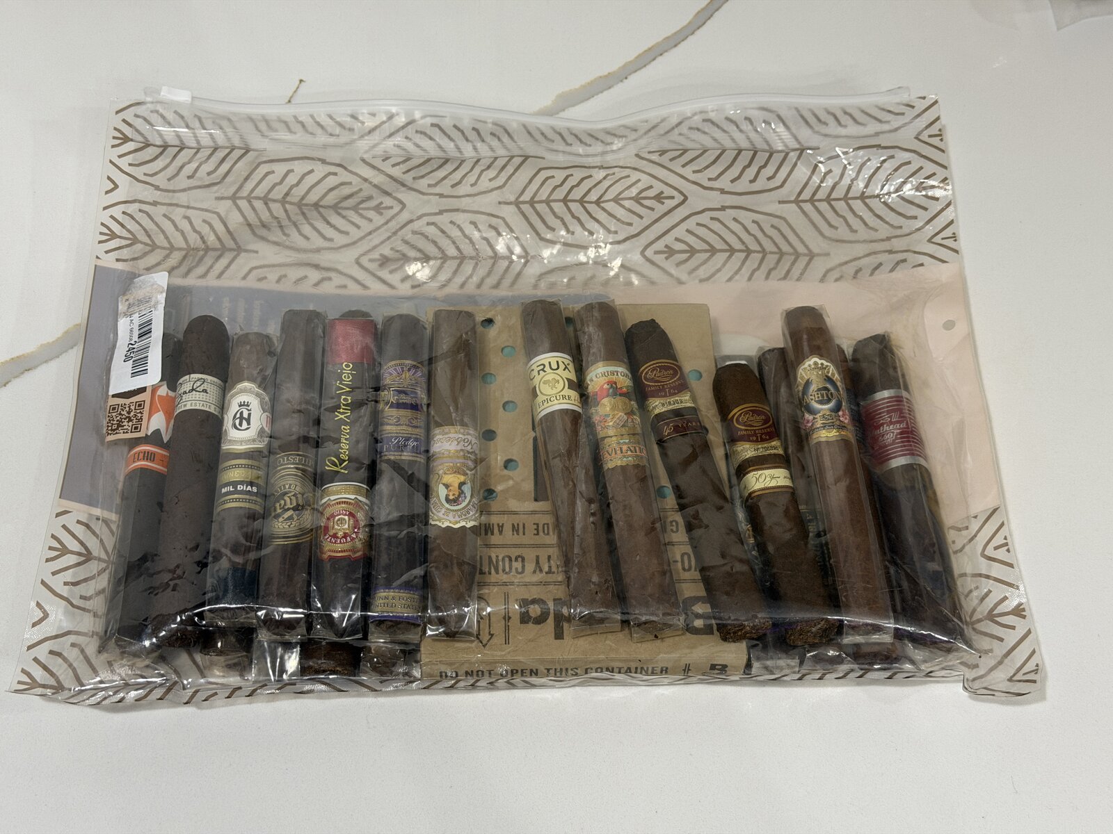 The Boveda bag loaded with a single layer of about fifteen premium cigars, with a 320-gram Boveda pack visible inside