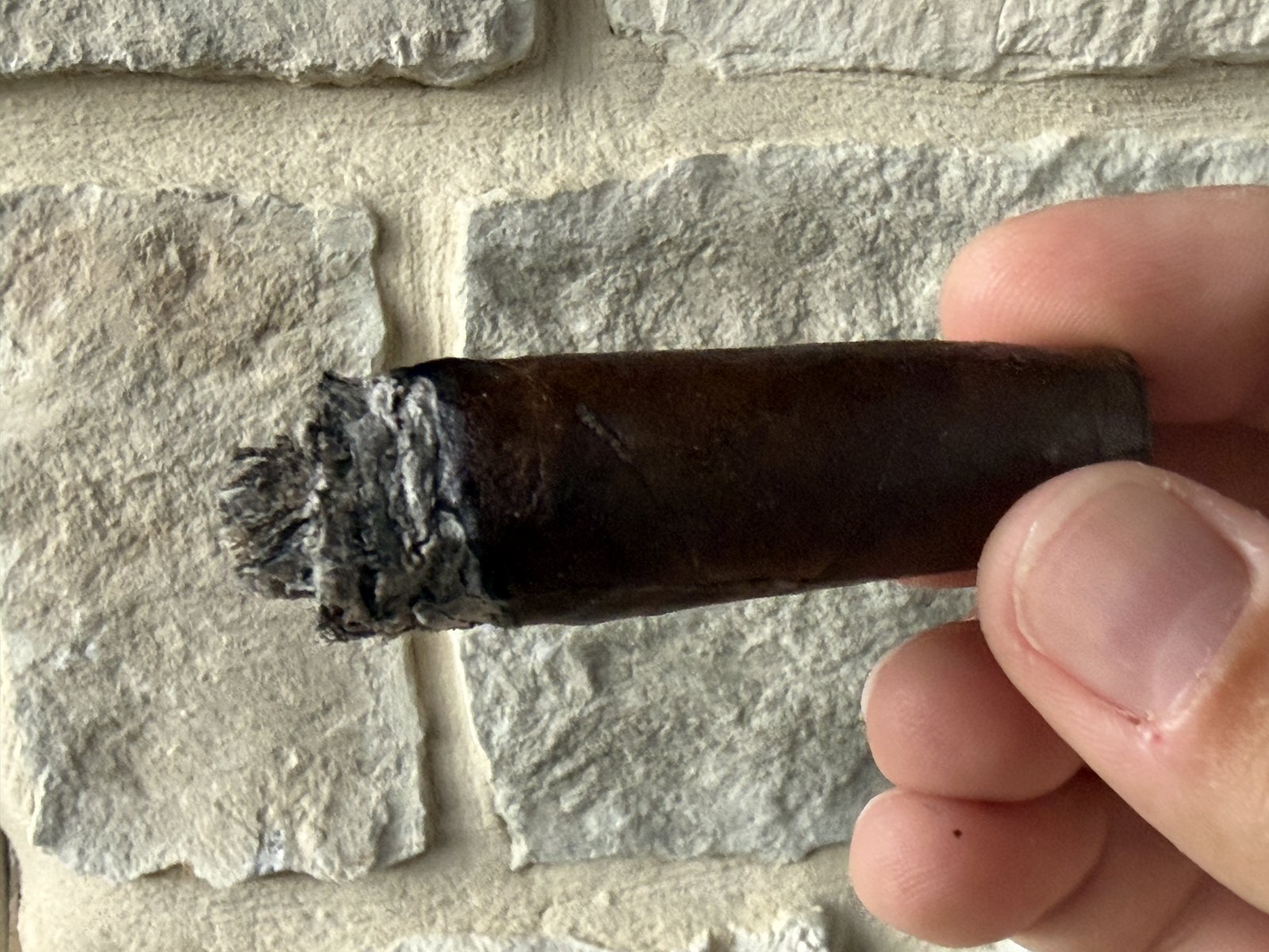 The nub of the Foundation 10 Year Aniversario, smoked down until it could no longer be held