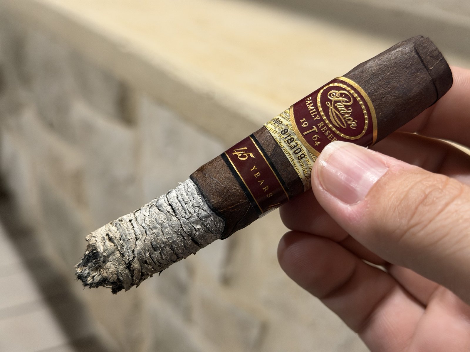 Padrón Family Reserve No. 45 Maduro two thirds of the way through the second third with a long tight stacked ash and a razor-sharp burn line