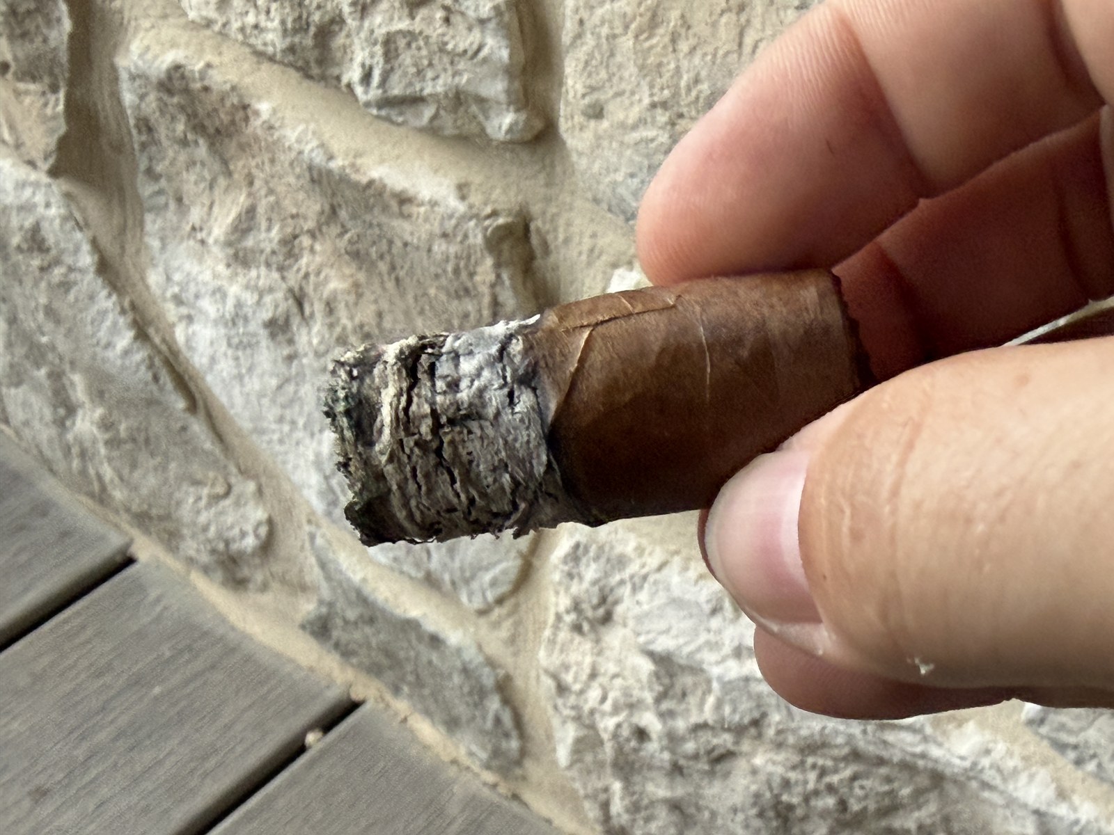 Nub of the Perdomo Legacy Nicaraguan Shade-Grown Epicure with the band off and a craggy gray ash on the foot